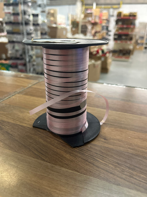 Tiny bit left of Curling Ribbon - pink