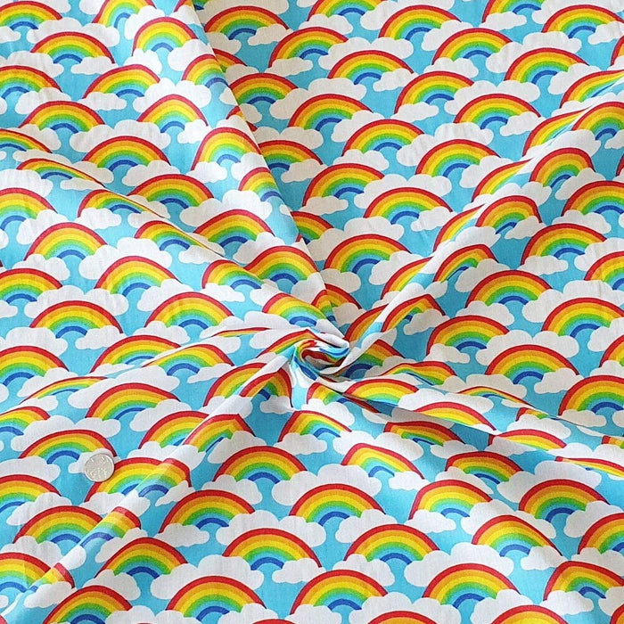 1 Metre Rainbows and Clouds Polycotton Fabric Sky Blue Background x 43"